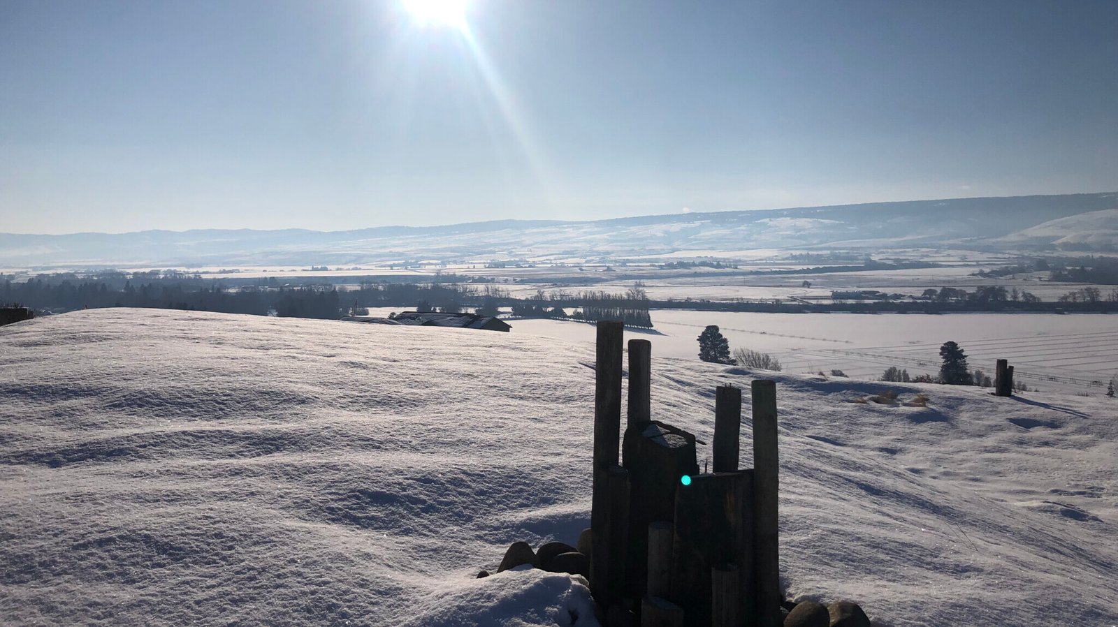 Bright sun over snowy landscape
